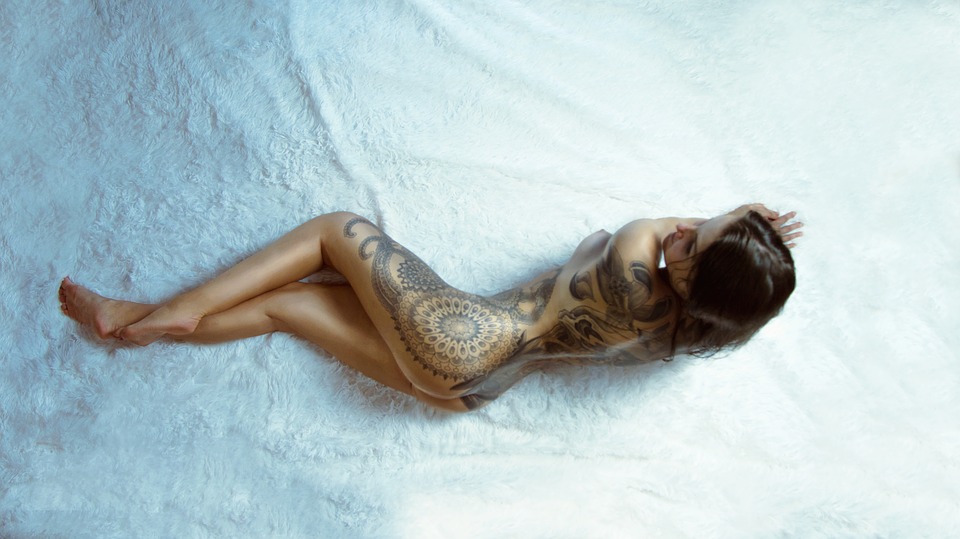 nude woman with tattoo
